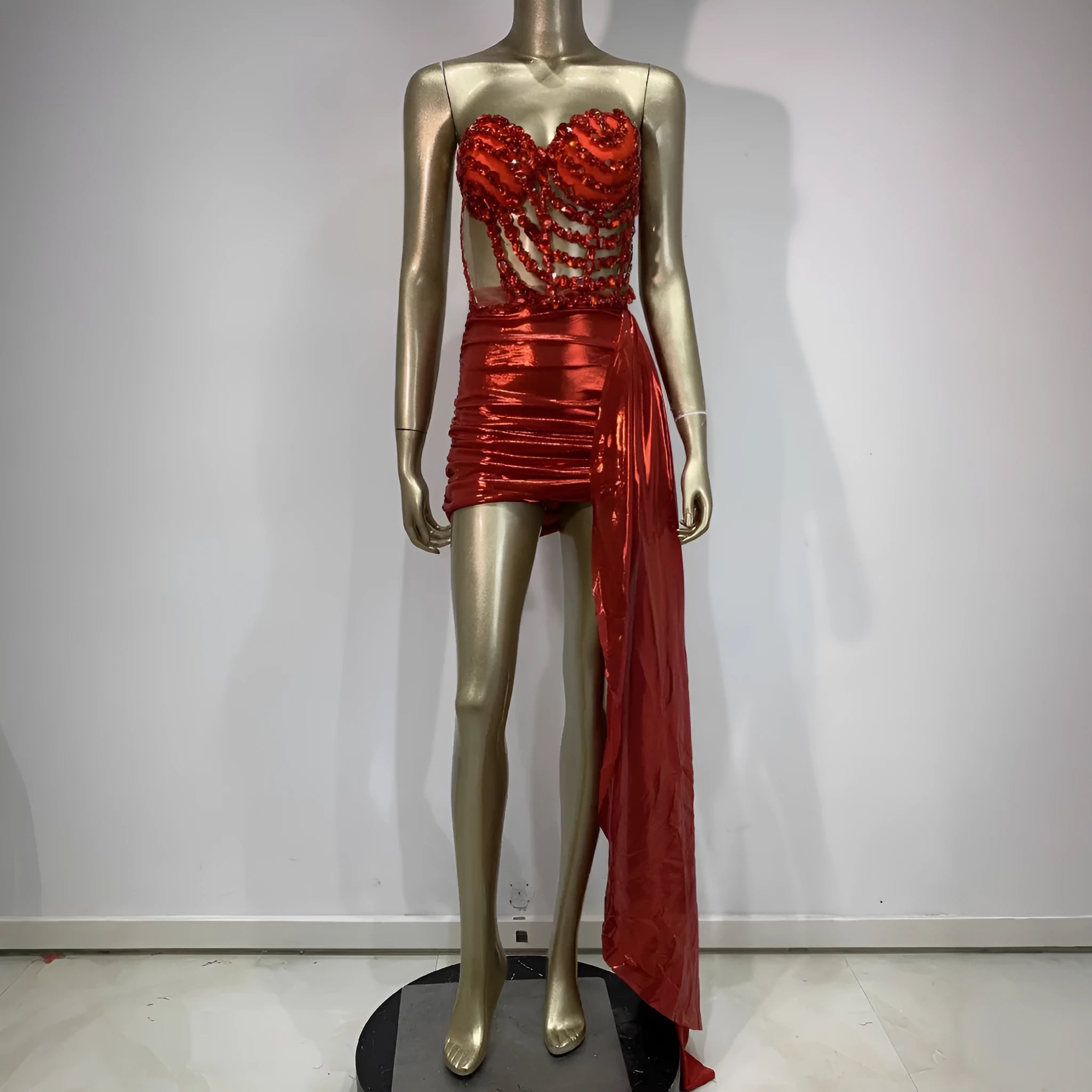 Red women's skirt suit with mesh see-through panels, a stage and party costume.