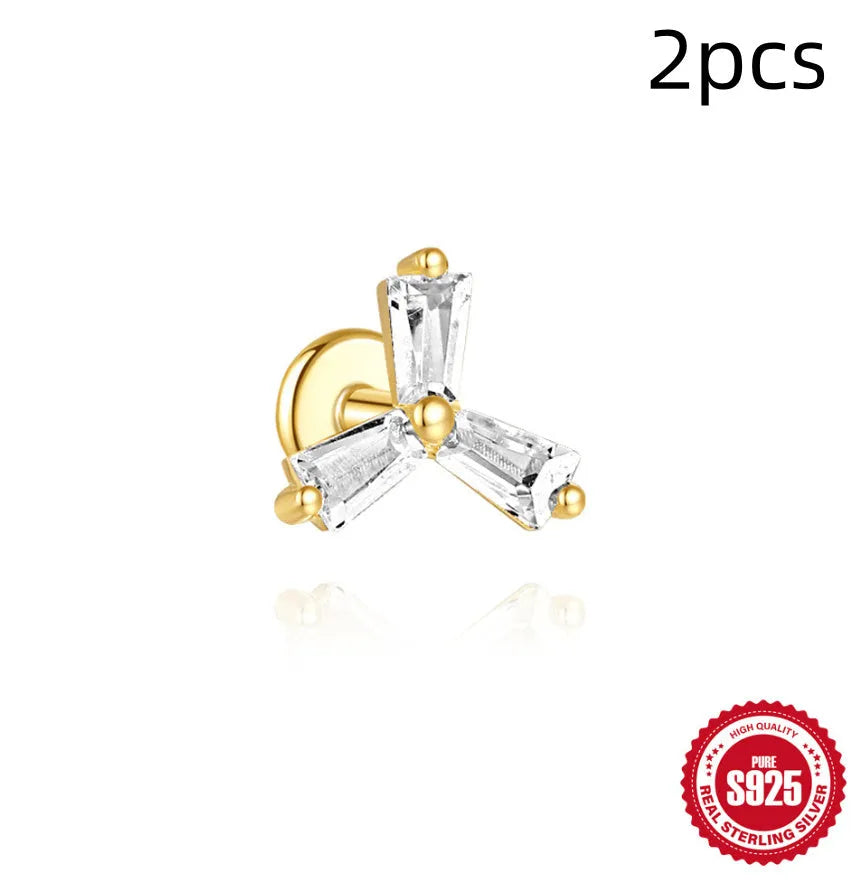 Close-up of a golden double ear piercings chain design stud earring made from S925 sterling silver with inlaid zircon stone.