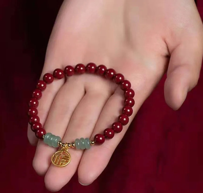 Gold cinnabar bracelet with wave design and copper beads in traditional Chinese style