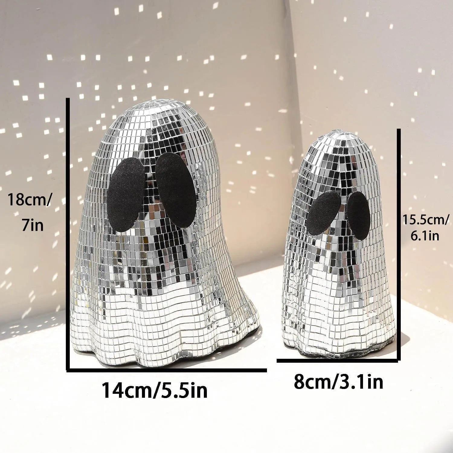 Silver Halloween ghost decoration with glass mosaic mirror patch design on dark surface