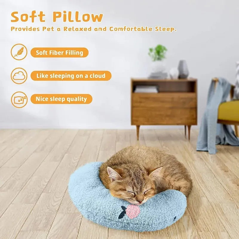 Small white U-shaped plush pet pillow for cats and small dogs on a neutral background.