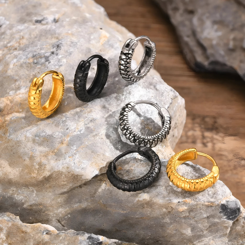 A pair of stainless steel hip hop earrings with a raised snake pattern, shown in black and gold colour options.