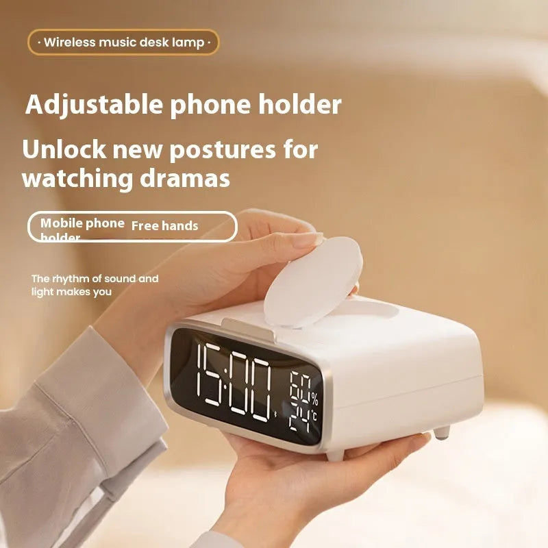 White wireless charger Bluetooth speaker with night light function on wooden surface