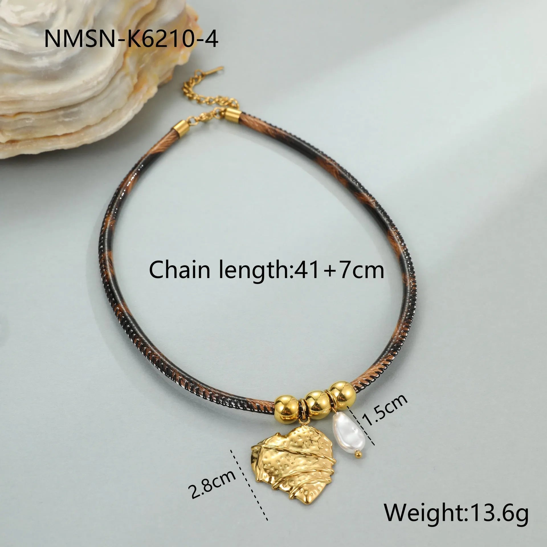 Geometric leopard print pendant on a stainless steel necklace chain with gold electroplated finish.
