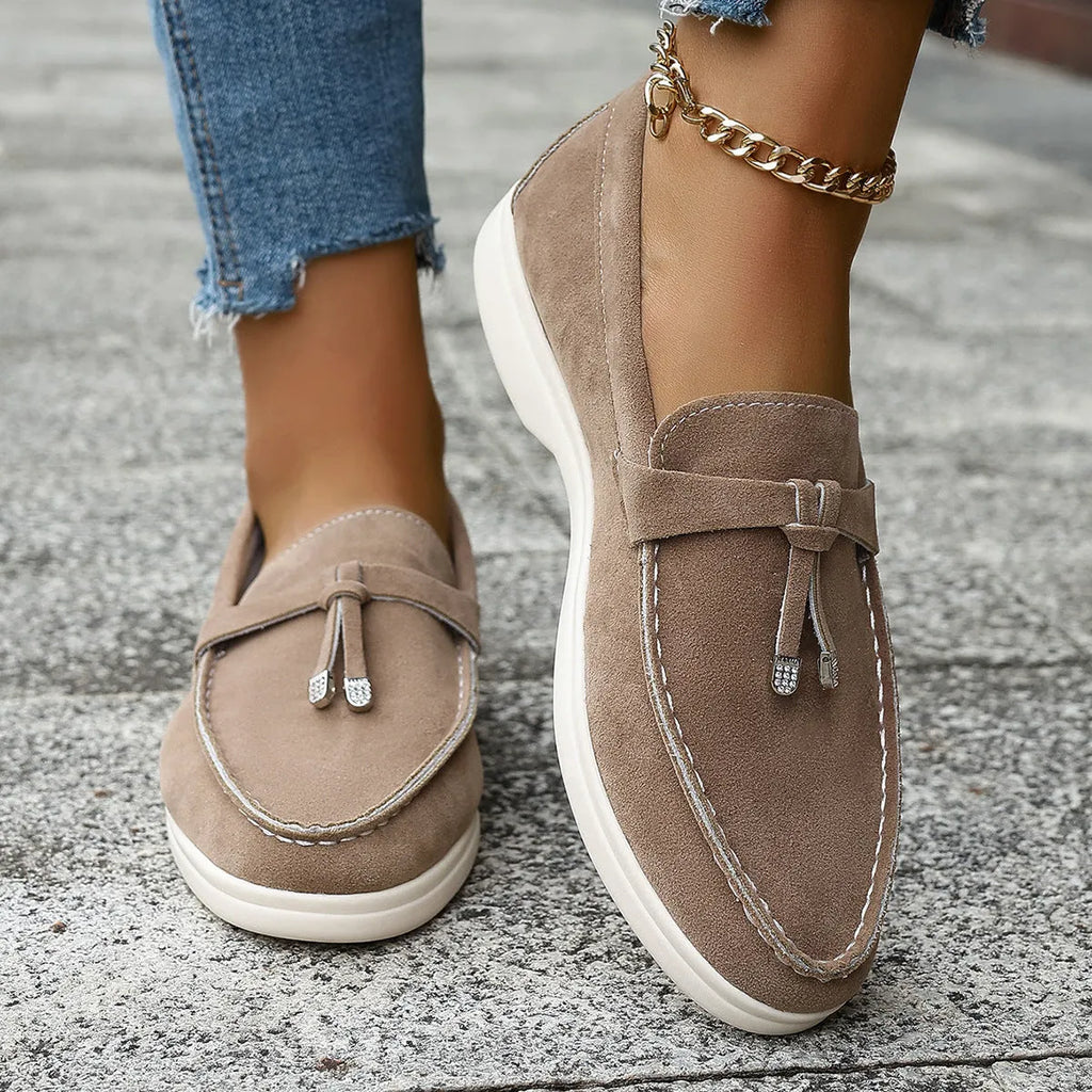 Casual canvas slip-on loafers with a round toe and platform heel, shown in a choice of colours.