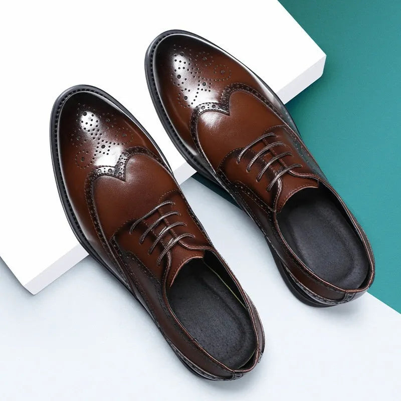 Men's classic black and brown brogue leather shoes with wingtip design on a white background.
