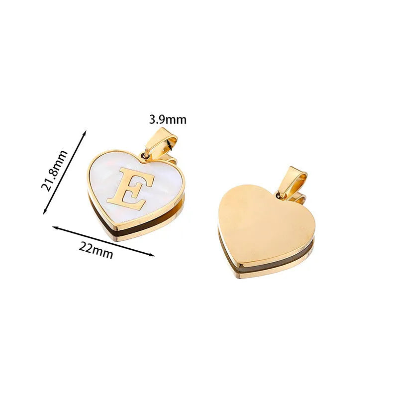 Gold plated heart pendant necklace with white shell centre on a stainless steel chain.