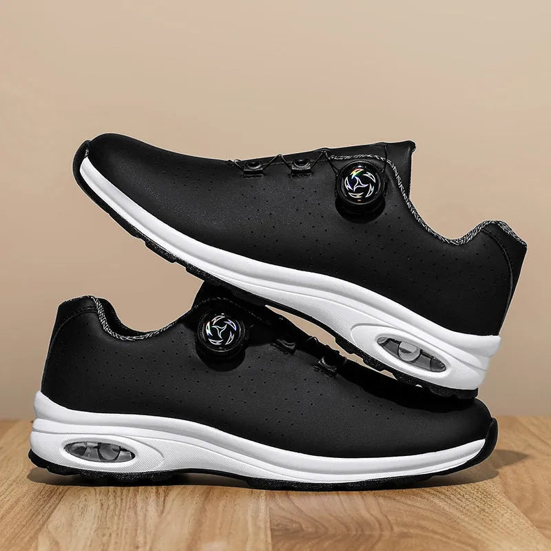 Black and white low-top mesh casual shoes with cross shoulder straps and a composite sole.