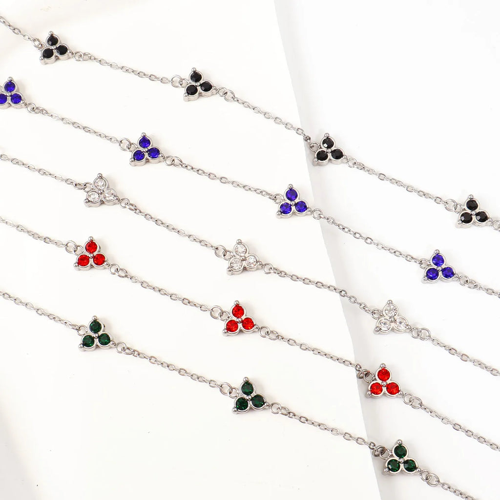 Geometric triangle women's bracelet in stainless steel with a choice of coloured centre stones on a gold or steel band.