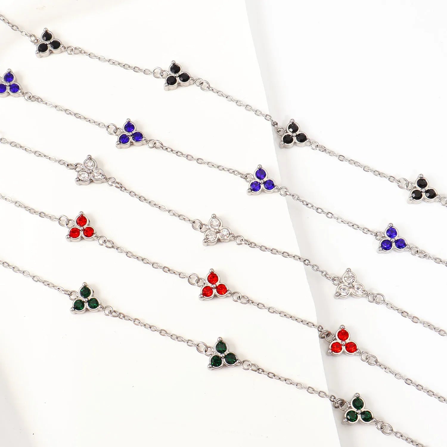 Geometric triangle women's bracelet in stainless steel with a choice of coloured centre stones on a gold or steel band.