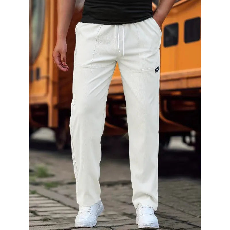 Men's polyester trousers for spring and autumn available in multiple colours and sizes