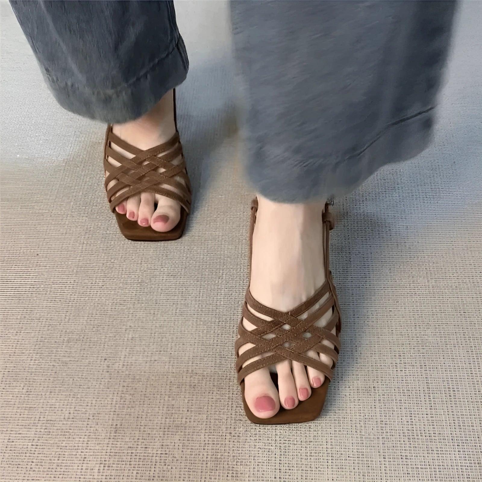 Light brown retro women's sandals with thin cross straps, ankle buckle, square toe, and a mid heel.