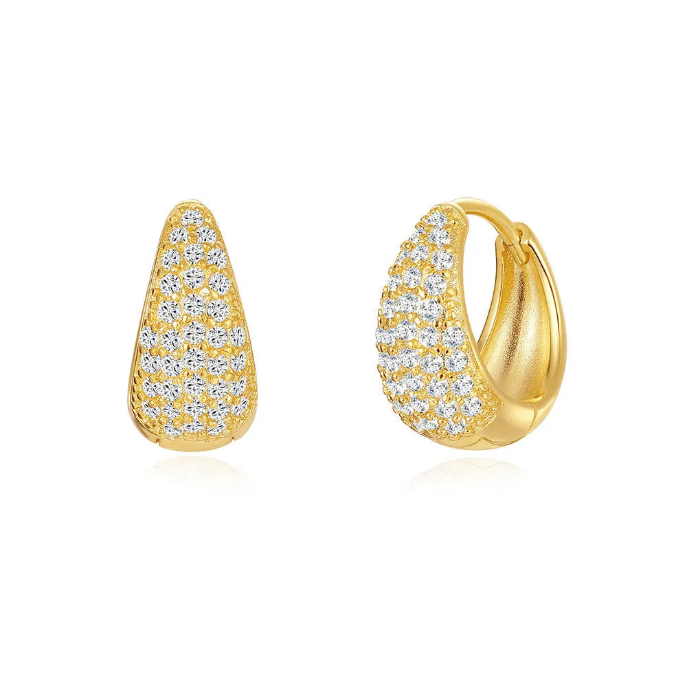 Golden brass earclip earrings with geometric round drop design on white background