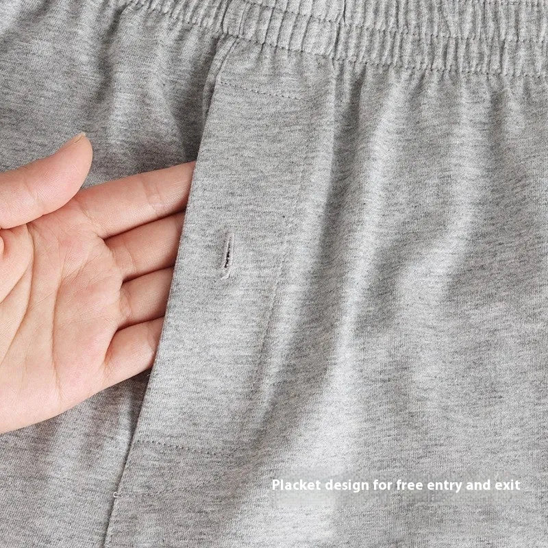 Men's high-waisted loose-fit cotton boxer shorts in black, grey, and navy blue.