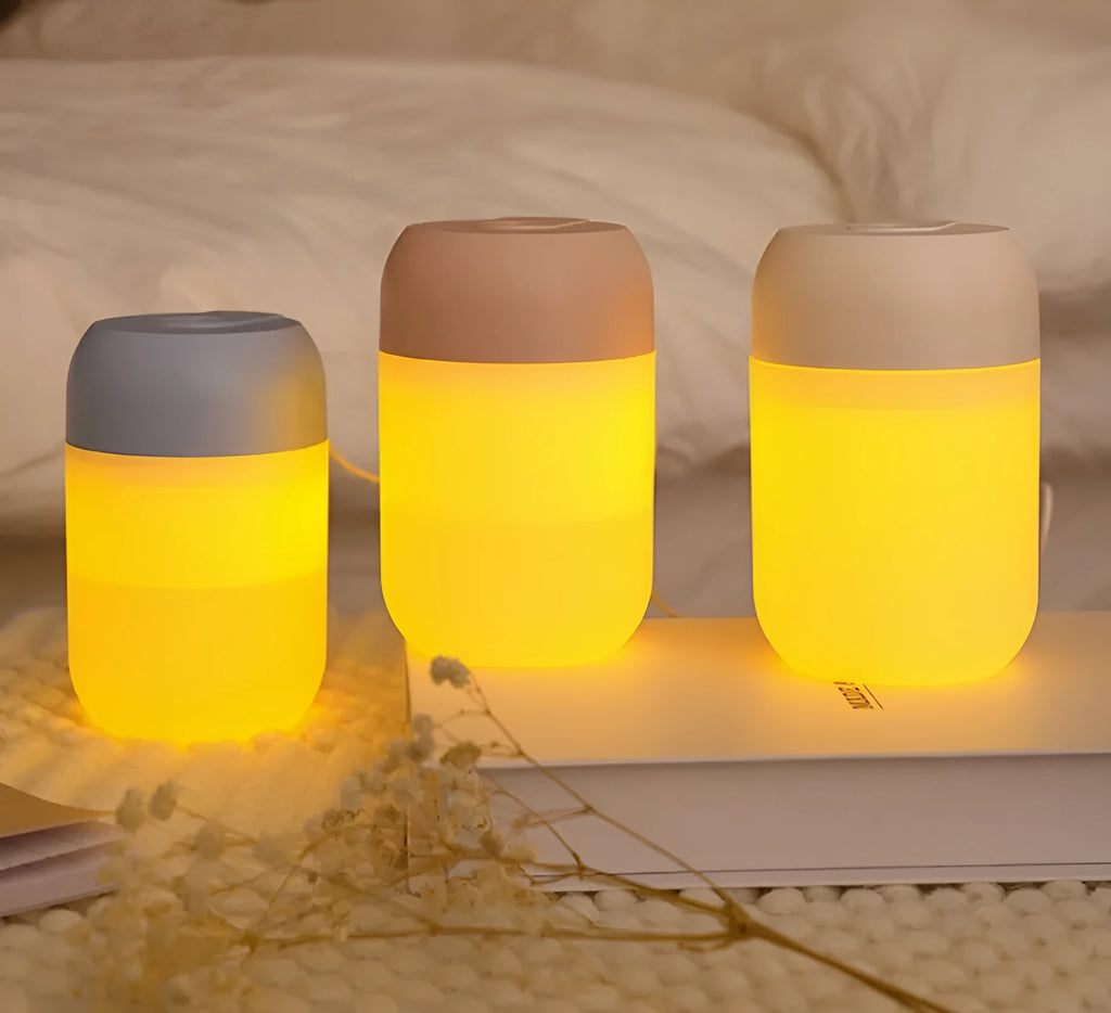 White cylindrical USB-powered humidifier with aromatherapy function on desk