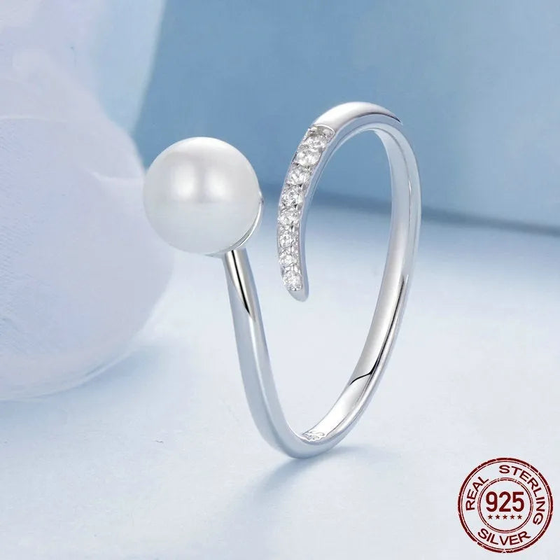 Adjustable S925 sterling silver ring featuring a natural shell pearl on a polished band.