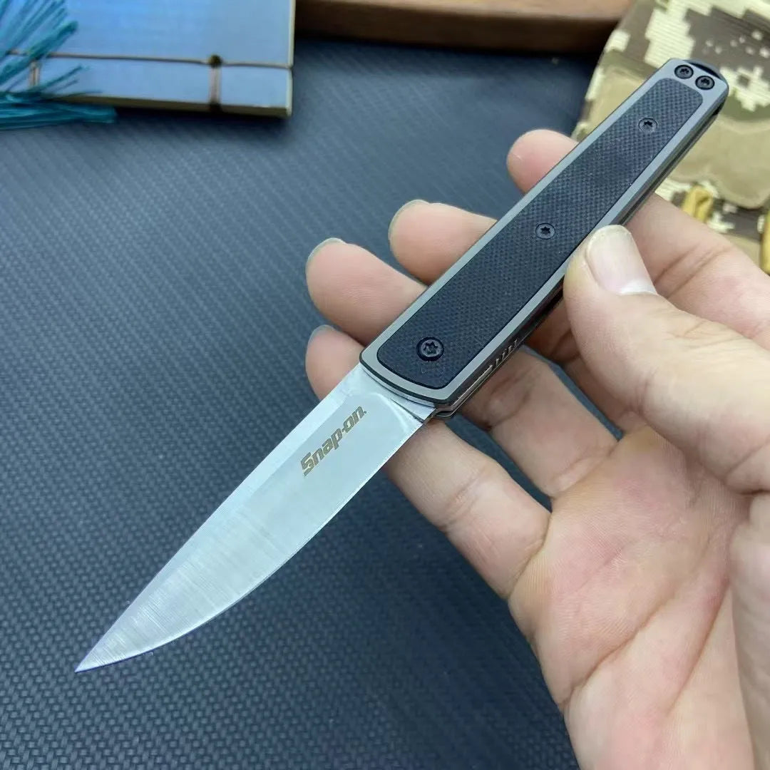 Folding fruit knife with stainless steel blade in black, red or coffee colour options, shown open to 17cm total length