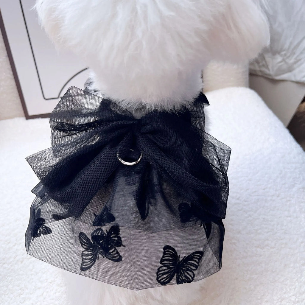 Black polyester tulle princess skirt costume for a small dog or cat on a mannequin, showing the gauzy fabric.