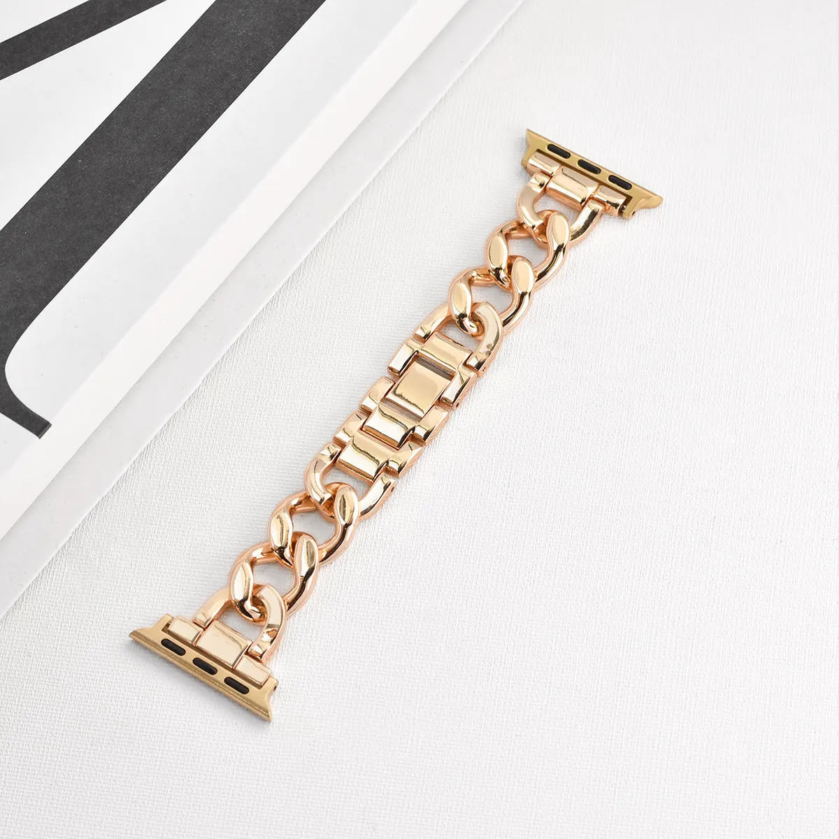 Metal denim chain replacement strap for Apple Watch in silver, black, gold, rose gold, and Starlight colours.