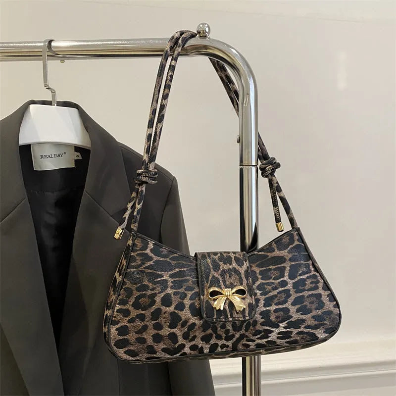 Large casual PU handbag for women in black, shown with sandwich pocket detail.