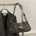 Large casual PU handbag for women in black, shown with sandwich pocket detail.