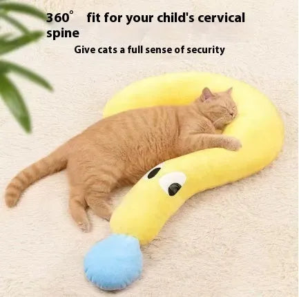 Blue U-shaped cat sleeping mat with moon design next to a yellow question mark shaped pet pillow.
