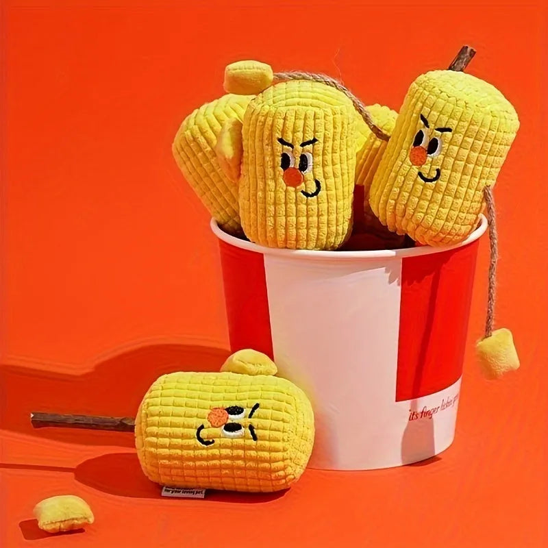 A corn cob shaped chew toy for cats made from polished beech wood, shown next to a tape measure indicating its 15cm length.