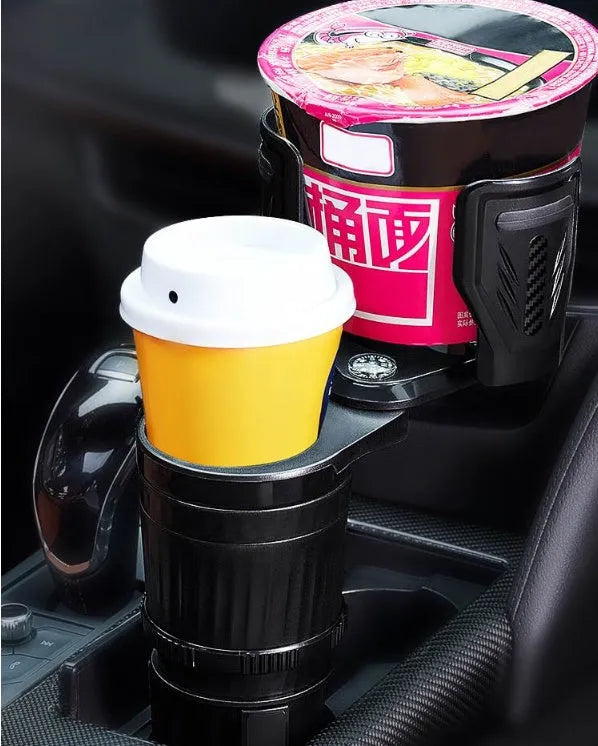 Black adjustable car cup holder with retractable base extended, showing carbon fibre pattern.
