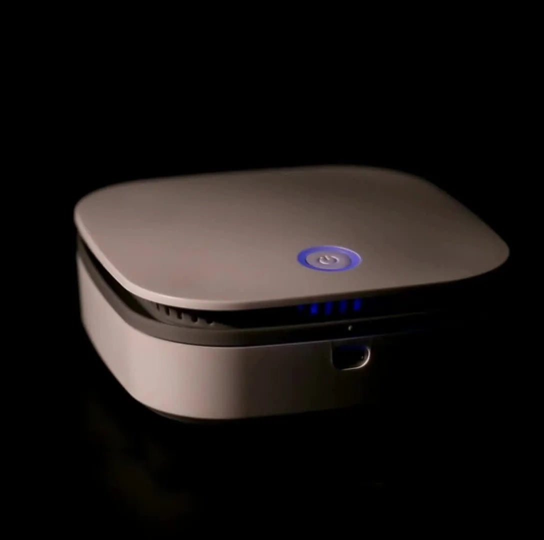White USB-powered car air purifier with button control for air disinfection.