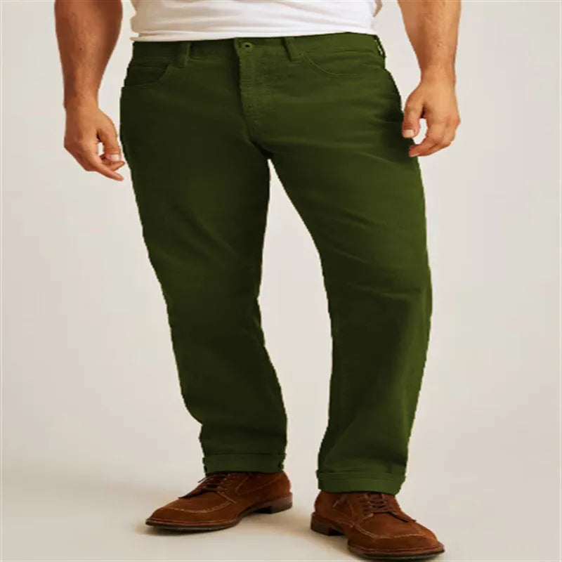 Men's corduroy straight leg trousers in army green showing mid waist and zip fly detail