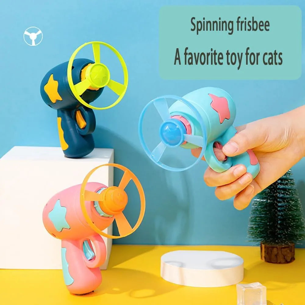 Blue interactive cat toy gun with spinning plastic frisbee for indoor feline play