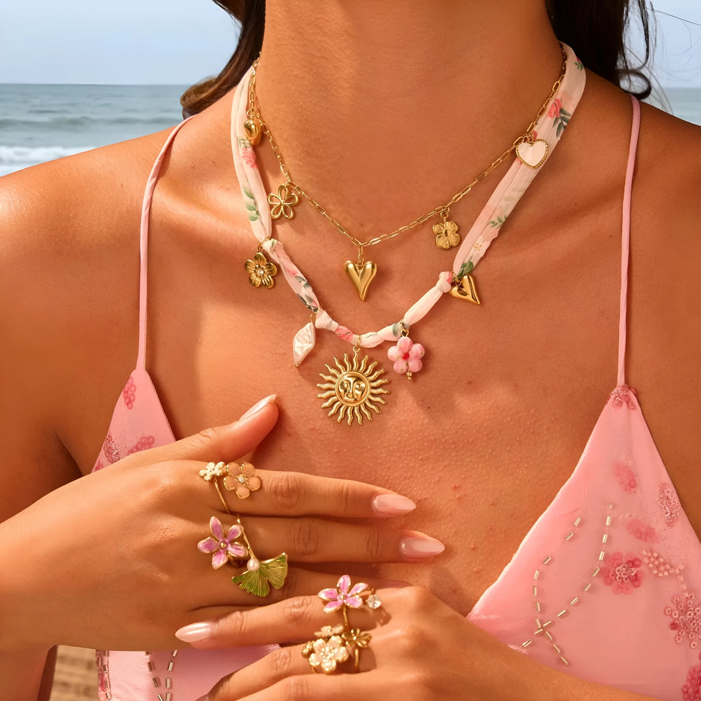 Stainless steel necklace with 18K gold electroplating and a geometric pendant, shown on a regular chain.