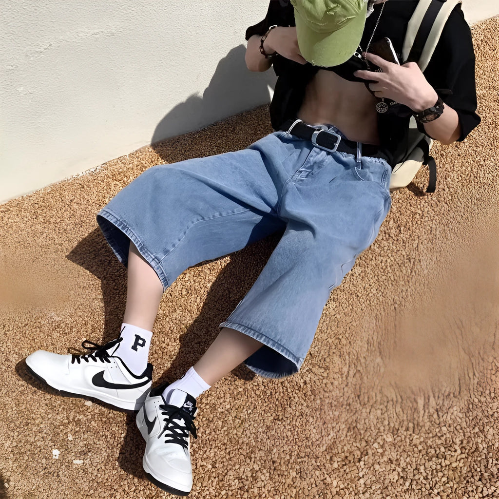 Men's washed blue denim cropped shorts with high waist and straight leg design