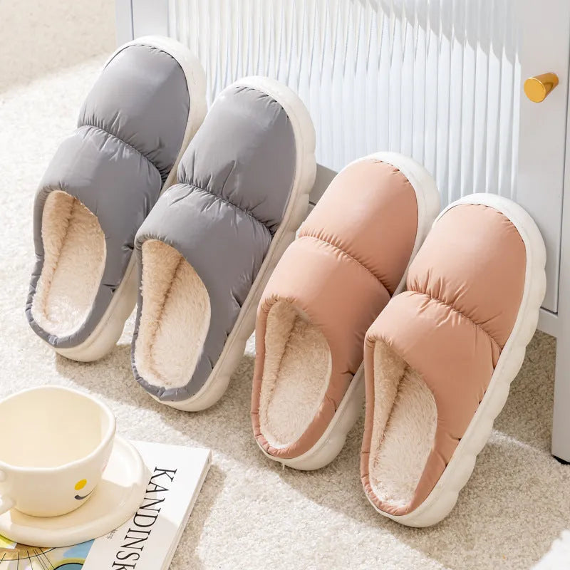 Blue winter slippers with artificial leather upper and thick rubber sole, showing plush lining.