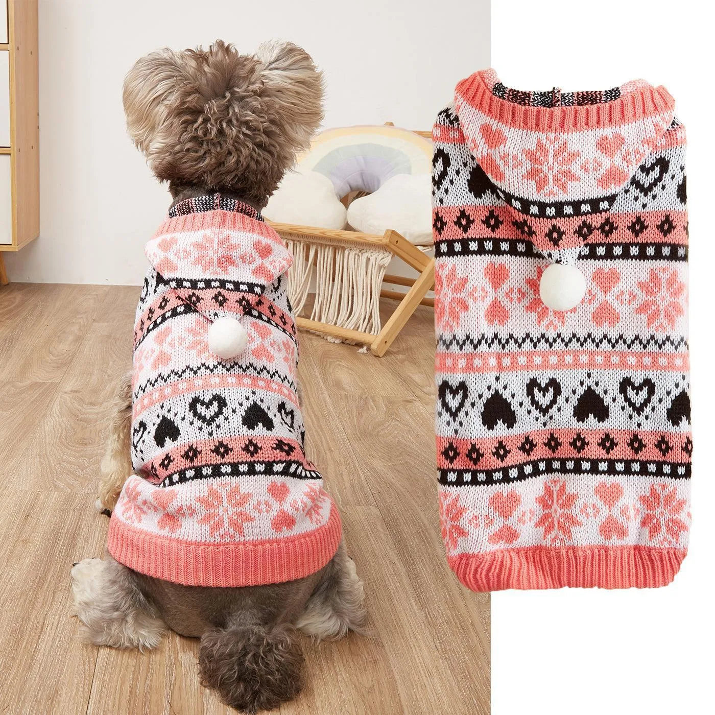 Pink striped dog sweater with snowflake and heart patterns on a small white Bichon