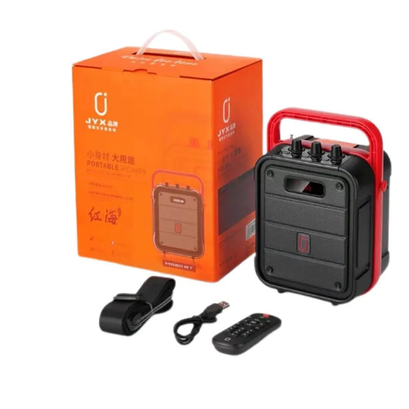 MS62AI portable Bluetooth speaker with wireless microphone and remote control on a table.