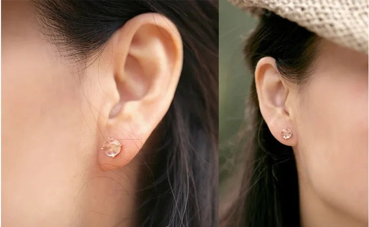 Rose gold drop shape stud earrings with synthetic ross quartz crystal inlay detail