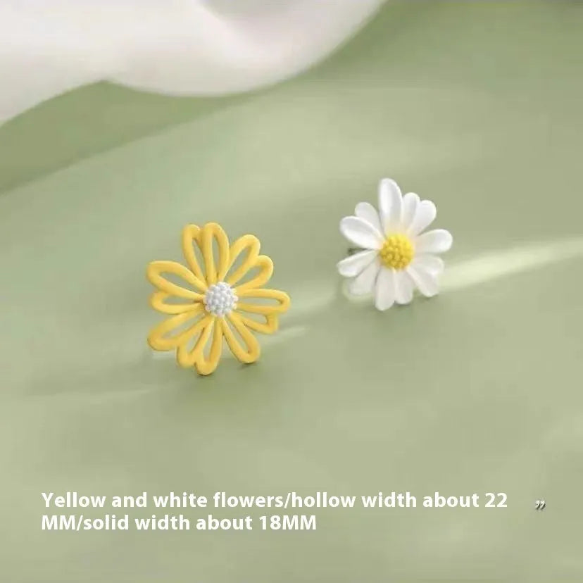Cartoon style flower stud earrings made from alloy in blue and orange two-tone colours.