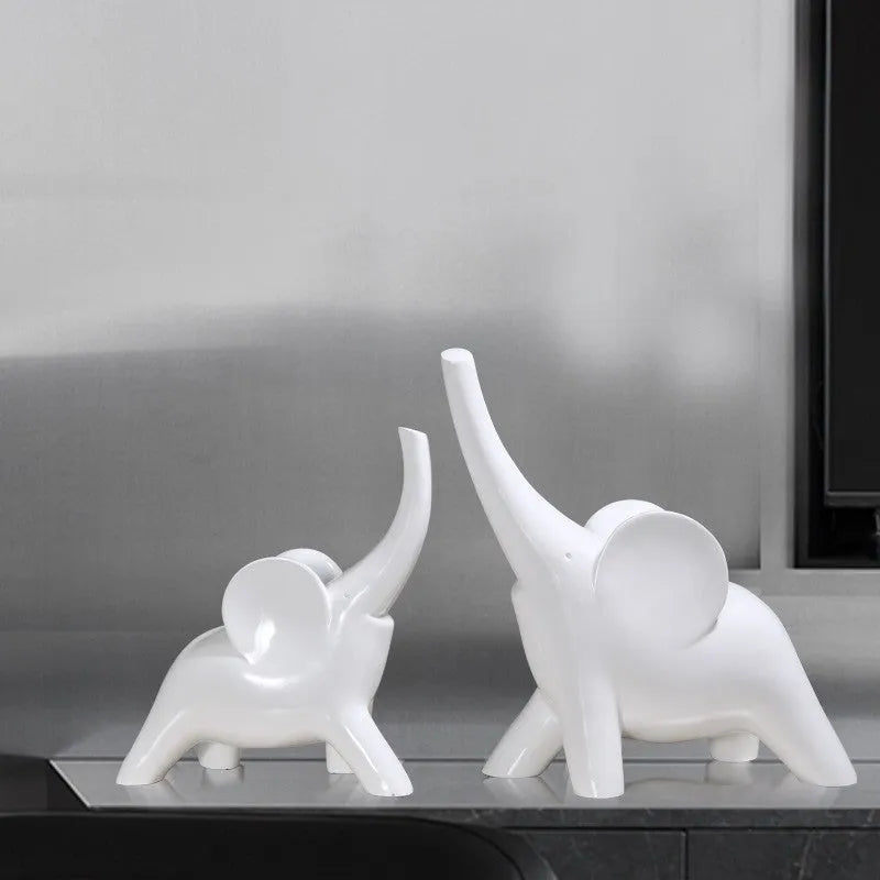 Modern resin elephant ornament in rose gold or white finish, available in large and small sizes