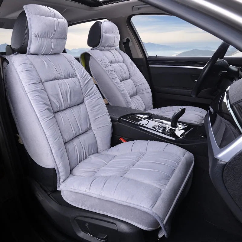 Short plush car seat cushion in charcoal grey on vehicle seat