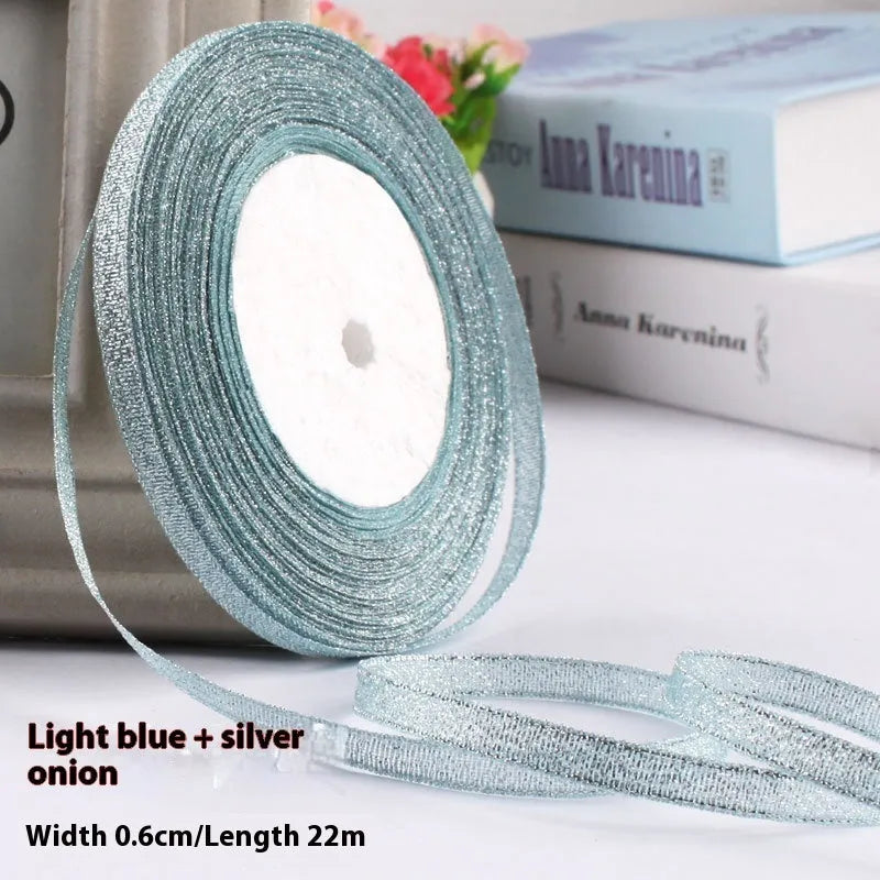 Roll of narrow 0.6cm wide polyester gift wrapping ribbon in assorted colours, showing 22 metre length.