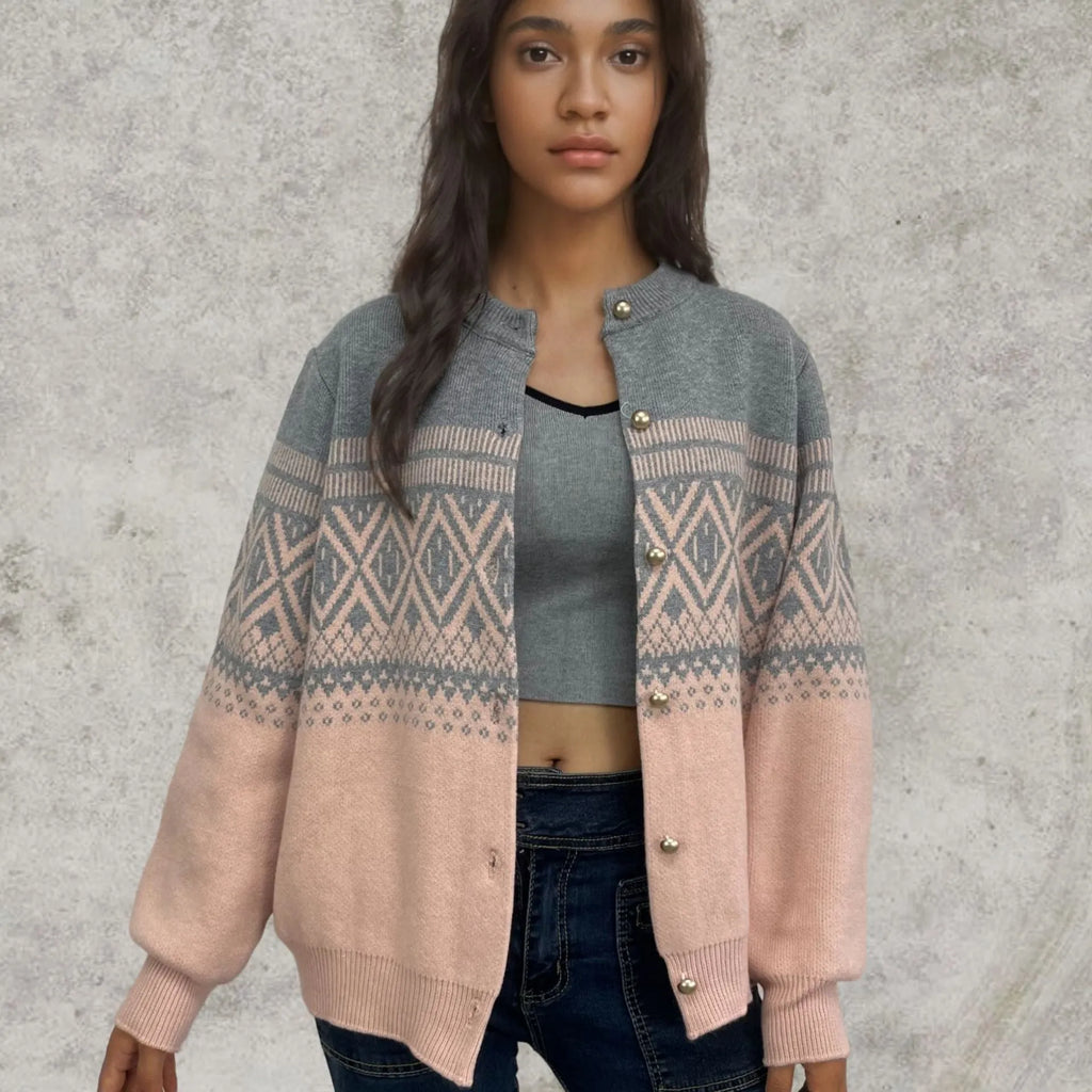 Women's grey alpaca wool cardigan with long sleeves and a red diamond contrast knit pattern.