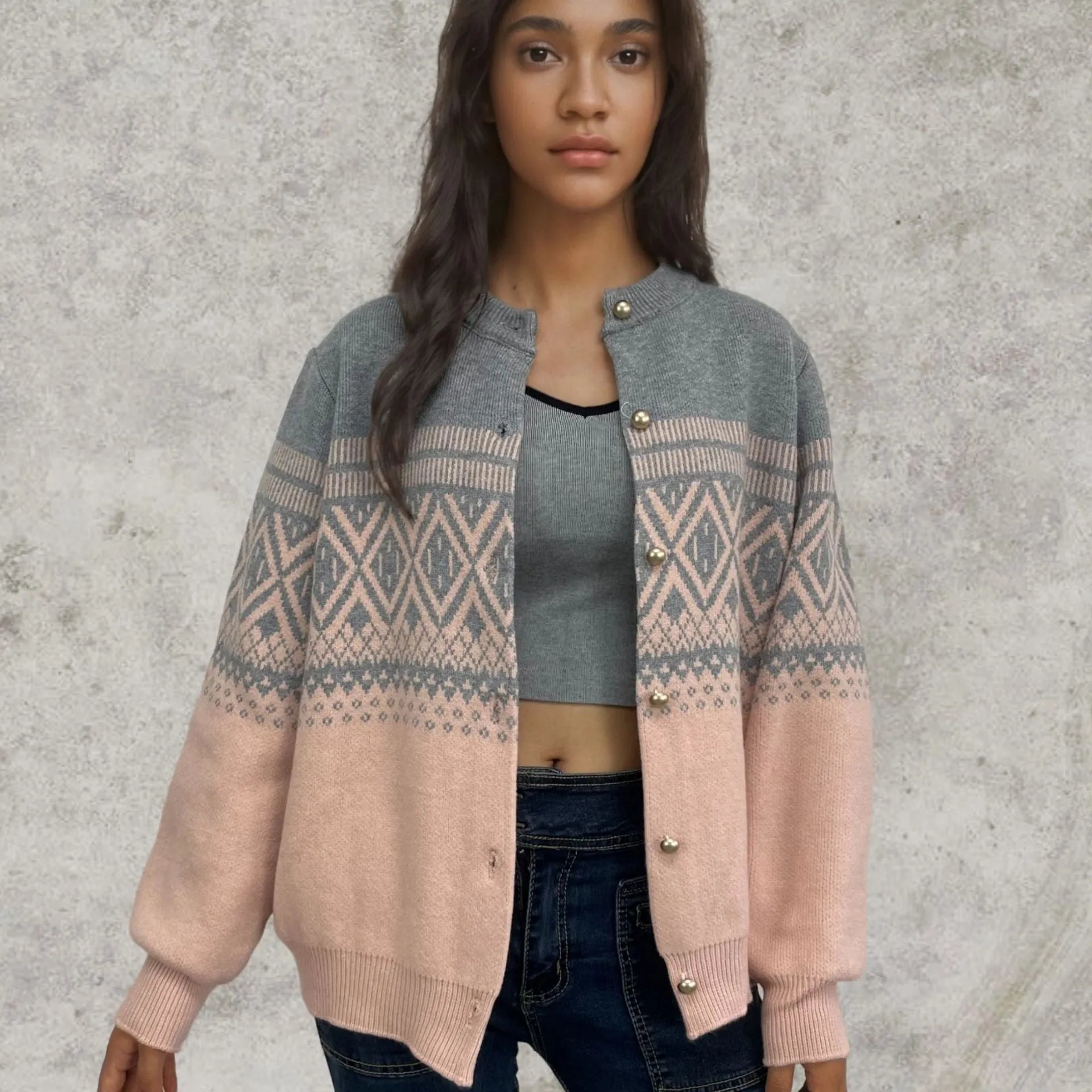 Women's grey alpaca wool cardigan with long sleeves and a red diamond contrast knit pattern.