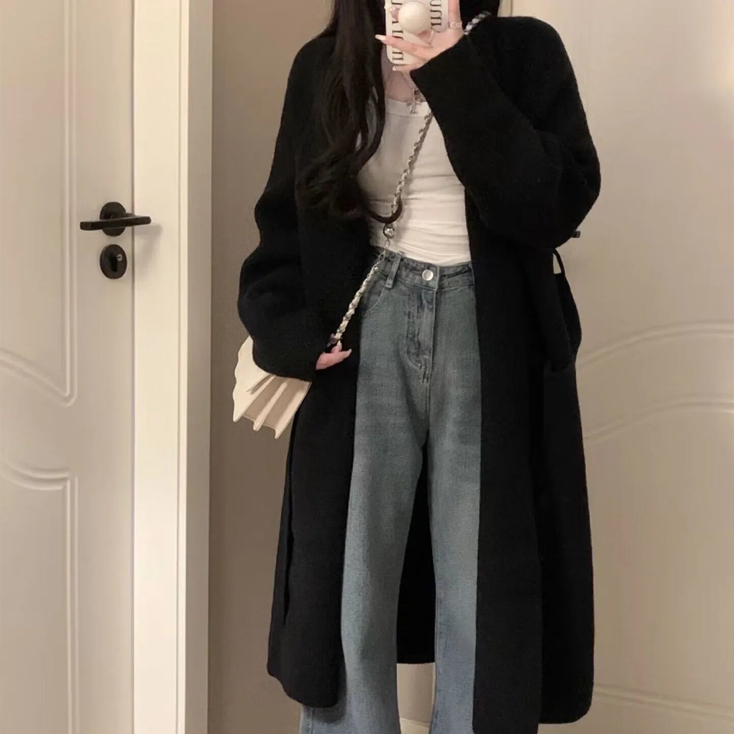 Loose dark grey knitted women's cardigan with 3D pattern texture and open front.