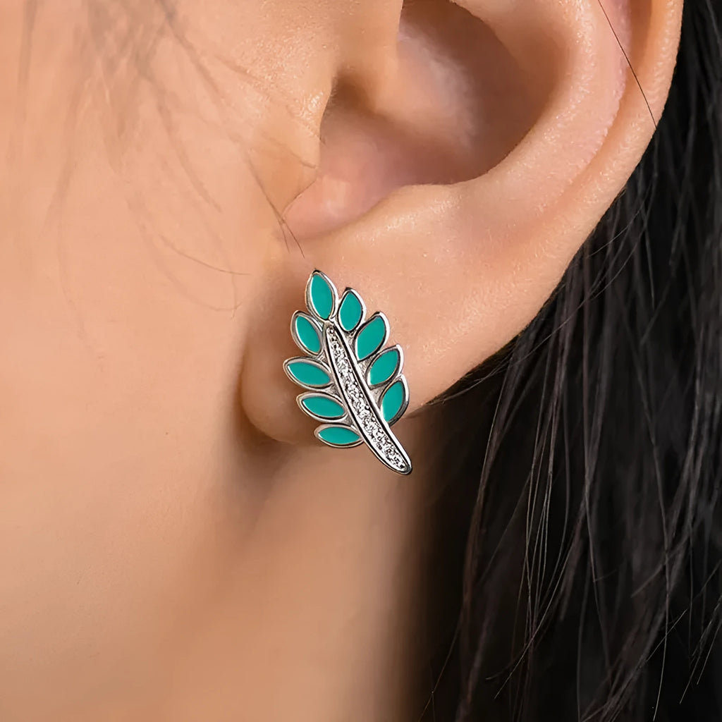 Pair of leaf-shaped copper stud earrings with white gold colour finish and inlaid zircon stone