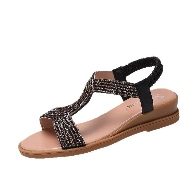 Women's patent leather summer sandals with rhinestone detail on round toe, shown in gold colour