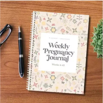 A5 sized weekly pregnancy diary notebook open on a page with the Pregnancy Weekly format