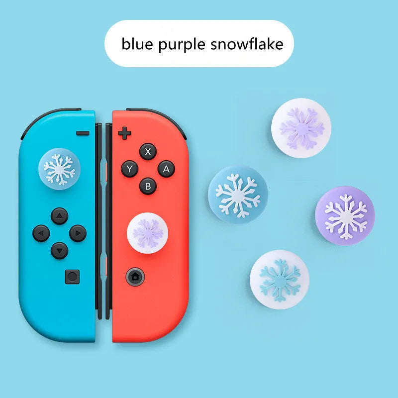 Four silicone rocker caps for Nintendo Switch Joy-Con controllers in assorted colours on a grey background.