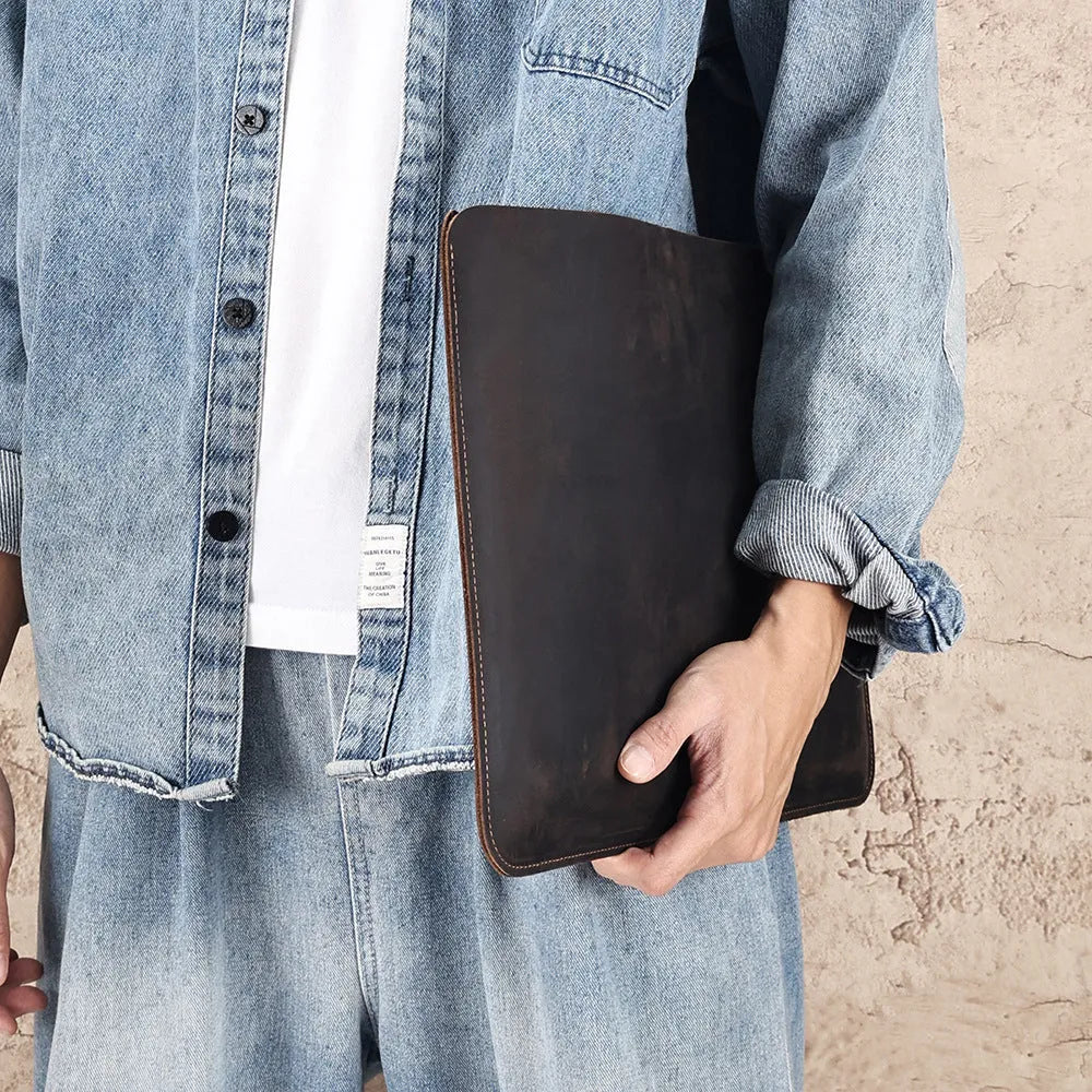 Men's brown horizontal leather liner bag with top handle and Crazy Horse cowhide texture
