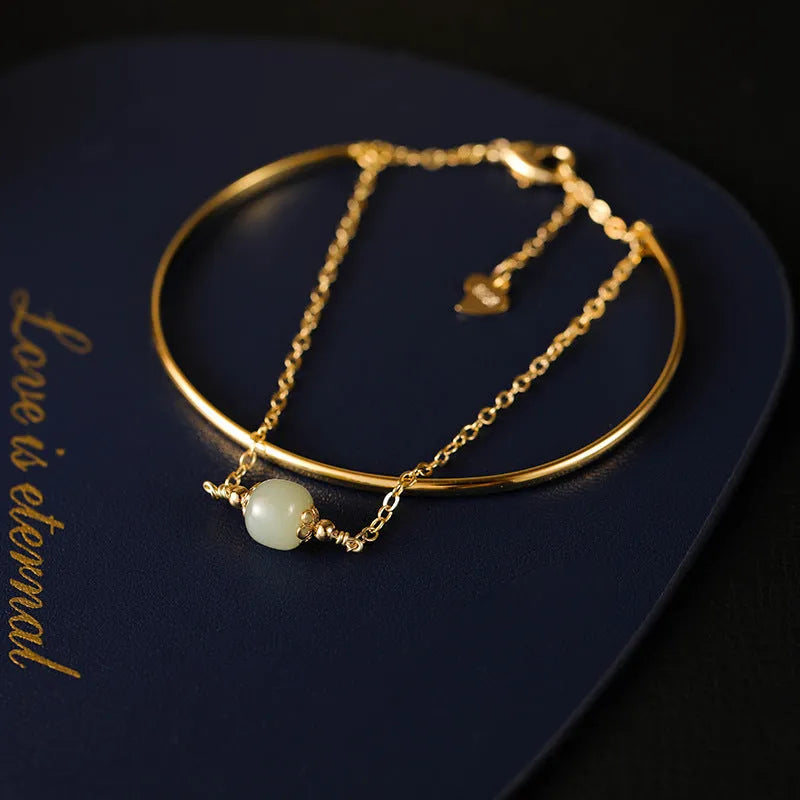Women's Hetian jade lucky beads bracelet with gold inlay in single, double, and three-bead versions.